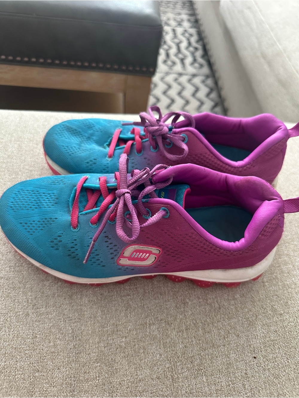 Used and well worn women’s Sketcher’s sneakers, size 5